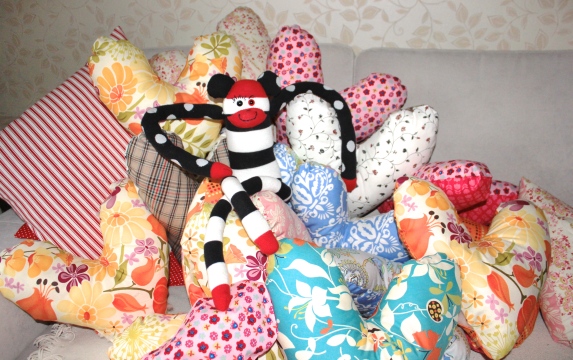 Sock Monkey Penelope helped us make over 60 heart pillows! 